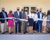 Jayne Malfitano, president of the Harcourt M. & Virginia W. Sylvester Foundation, and the HomeSafe board of directors officially open the Sylvester Family West Campus.